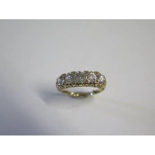 41 - A yellow gold five stone diamond ring - the centre stone approx 0.50ct - ring size with spacers L/M ... 