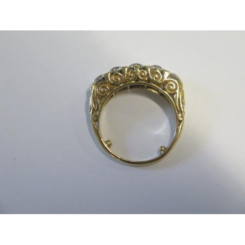 41 - A yellow gold five stone diamond ring - the centre stone approx 0.50ct - ring size with spacers L/M ... 