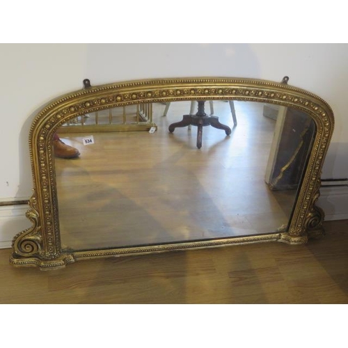 534 - A Victorian gilt over mantle mirror - 69cm x 120cm