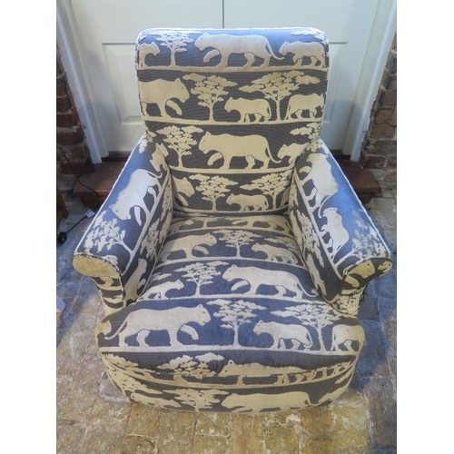 536 - A reupholstered Victorian armchair in a designer wild cat fabric - some wear to fabric