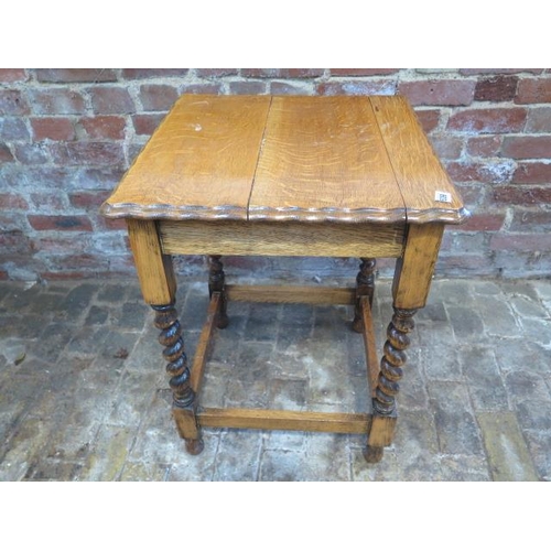 539 - A 1930's oak side table with a pie crust top and barley twist legs