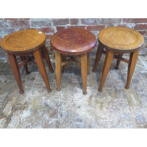 540 - Three oak stools with a Gaskell & Chambers Ltd plaque - one with an upholstered top, the other two w... 