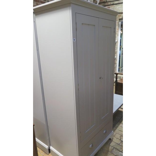 558 - A good quality painted two door wardrobe with a base drawer - generally good condition, some small m... 