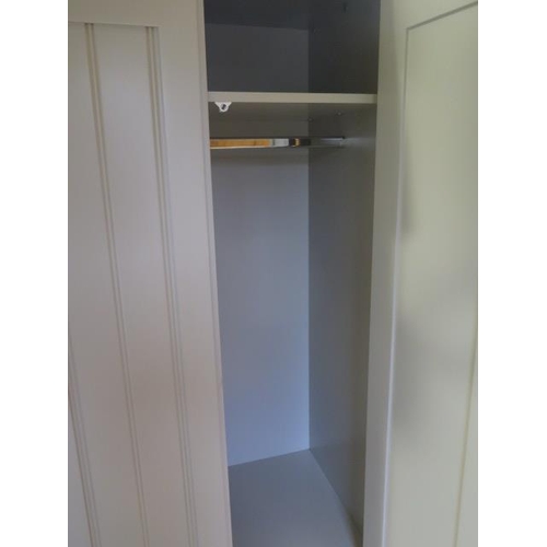 559 - A good quality painted two door wardrobe with a base drawer - generally good condition, some small m... 