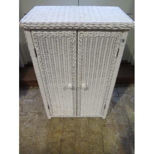 561 - A white painted wicker bathroom cabinet - Height 87cm x 56cm x 33cm