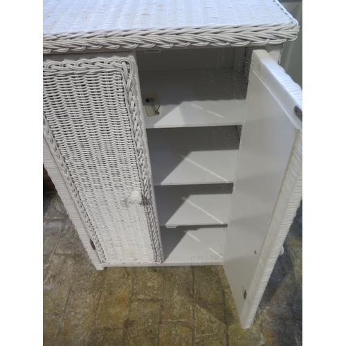 561 - A white painted wicker bathroom cabinet - Height 87cm x 56cm x 33cm