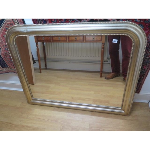 562 - A silver gilt over mantle mirror - 90cm x 111cm scuffs to front