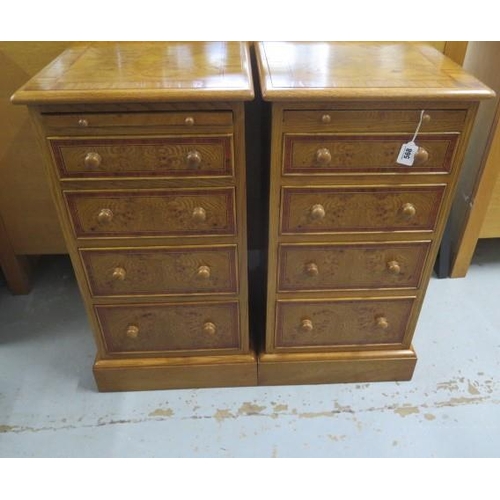 568 - A pair of burr oak bedside chests with a slide above four drawers made by a local craftsman to a hig... 