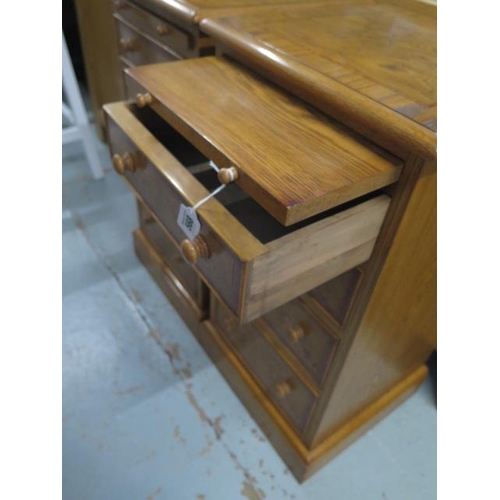 568 - A pair of burr oak bedside chests with a slide above four drawers made by a local craftsman to a hig... 