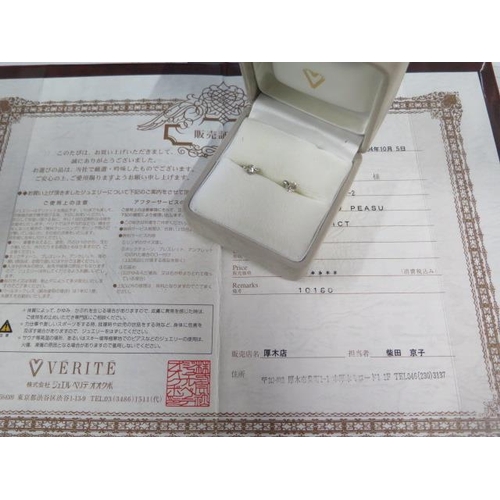 57 - A pair of platinum diamond earrings - each approx 0.40ct - with certificate