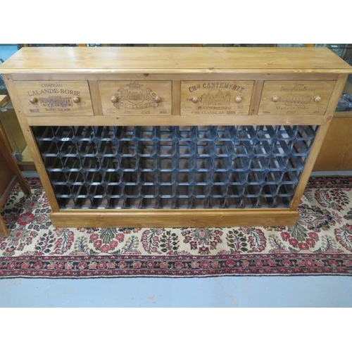 570 - A new pine 72 bottle wine rack with four wine box fronted drawers made by a local craftsman to a hig... 