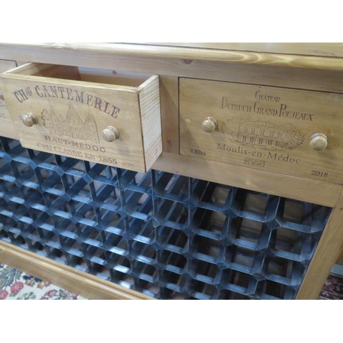 570 - A new pine 72 bottle wine rack with four wine box fronted drawers made by a local craftsman to a hig... 