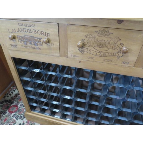 570 - A new pine 72 bottle wine rack with four wine box fronted drawers made by a local craftsman to a hig... 