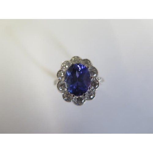 An 18ct yellow gold Tanzanite and Diamond ring - Tanzanite approx 2cts (very good colour) - Diamond approx 1ct, bright and lively - Head size approx 16.5mm x 14.5mm - ring size P