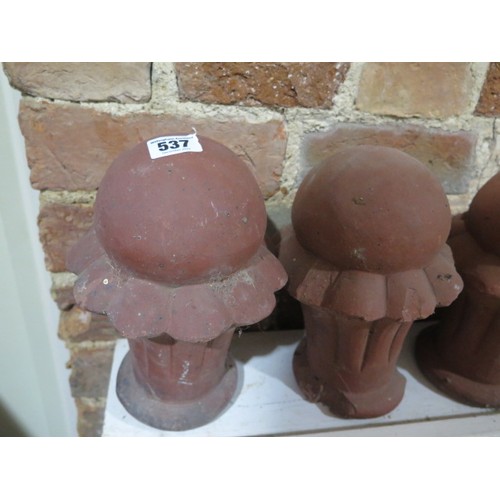 537 - A set of 11 terracotta finials - Height 24cm