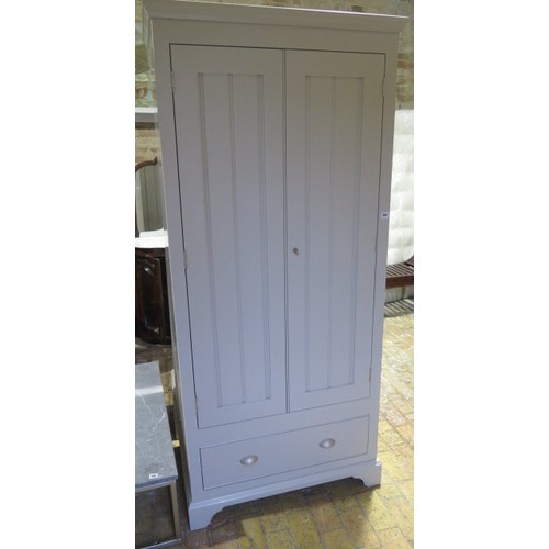 559 - A good quality painted two door wardrobe with a base drawer - generally good condition, some small m... 