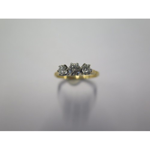 73 - An 18ct yellow gold three stone diamond ring size O approx 2gs