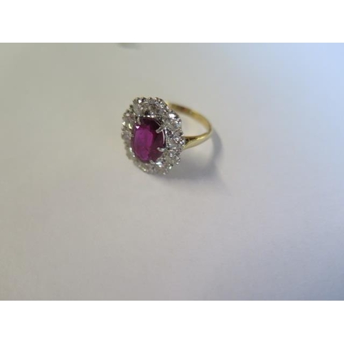 39 - A vintage 18ct yellow gold ruby and diamond ring - ruby approx 2.5 carats, surrounded by approx 1.25... 