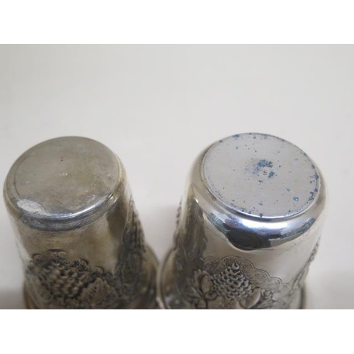 123 - A pair of graduating 925 silver grape pattern embossed stirrup cups - Largest 8cm tall - total appro... 