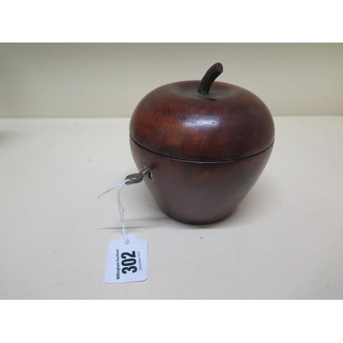 262 - A new carved wooden pear shaped caddy with key - Height 12cm