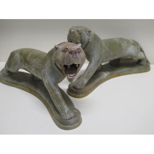 275 - A pair of green soapstone tigers - Height 18cm x Length 30cm