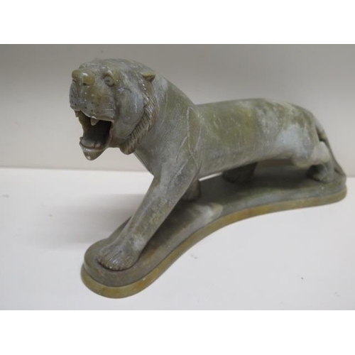 275 - A pair of green soapstone tigers - Height 18cm x Length 30cm