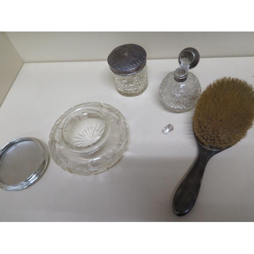 122 - Three silver top bottles/tidies, four silver back brushes, two silver back mirrors (one missing glas... 