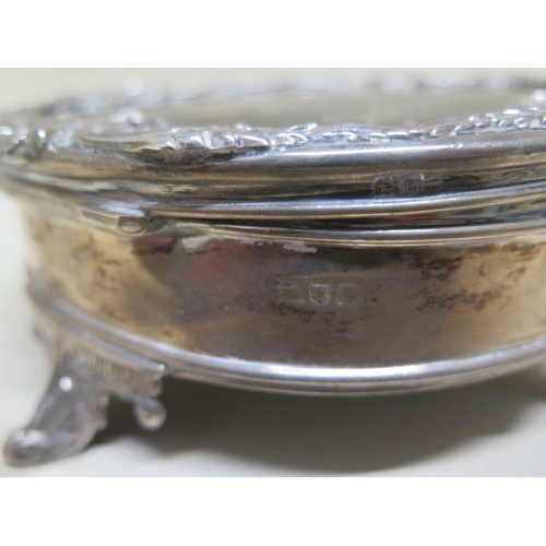 128 - A silver and tortoiseshell lidded jewellery box - 7cm tall x 16cm diameter - some wear/bending