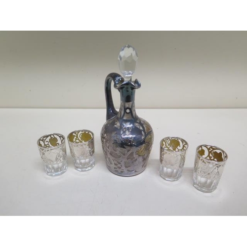 130 - A silver wrapped liquor decanter - Height 16cm (glass broken) and four glasses