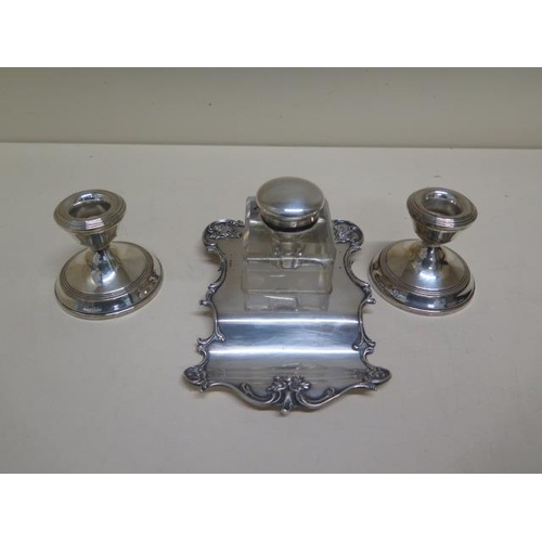 132 - A silver desk stand and a pair of weighted silver candle sticks - weighable silver approx 4.6 troy o... 
