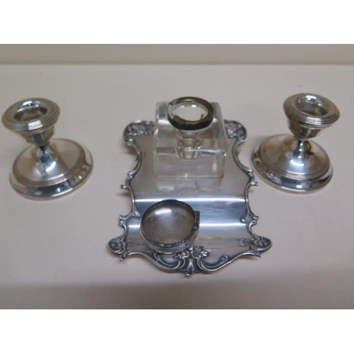 132 - A silver desk stand and a pair of weighted silver candle sticks - weighable silver approx 4.6 troy o... 
