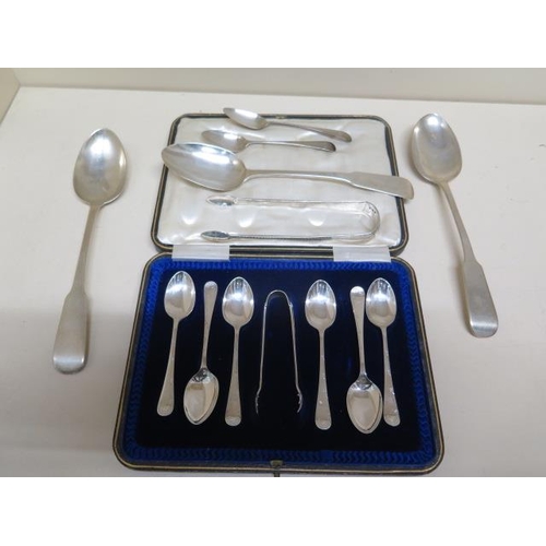 133 - A boxed set of six silver teaspoons with replacement nips,m three silver table spoons, two silver te... 
