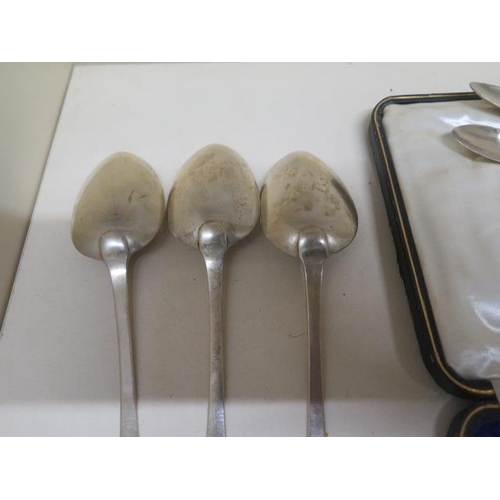 133 - A boxed set of six silver teaspoons with replacement nips,m three silver table spoons, two silver te... 