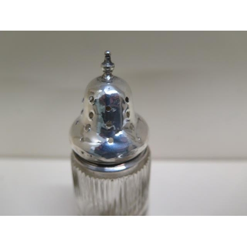 134 - Two silver top glass tidies and a glass shaker - top dented, weighable silver approx 2.46 troy oz