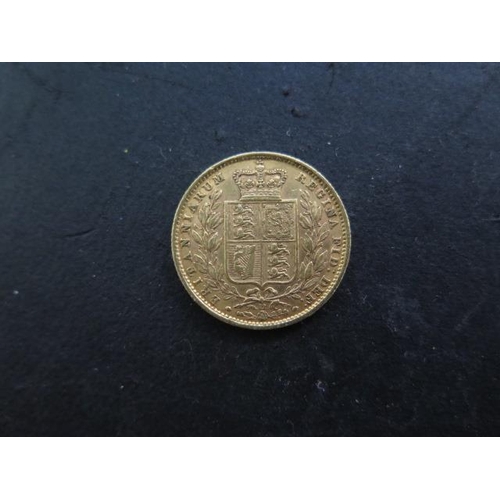 244 - A Victorian young head shield back gold full sovereign dated 1871