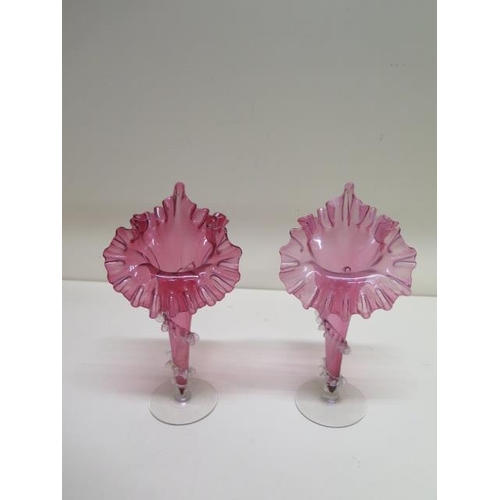 268 - A pair of Cranberry glass jack in the pulpit type vases, 22cm tall, one has a repair to base stem, o... 