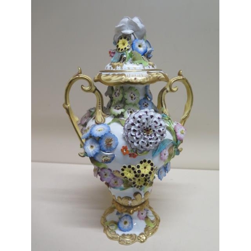 281 - A 19th century floral encrusted lidded twin handle vase - Height 35cm - some losses and repairs