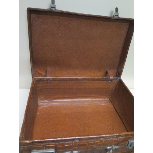 287 - A vintage Drew and Sons of London crocodile skin suitcase - with some old repairs, in polished condi... 