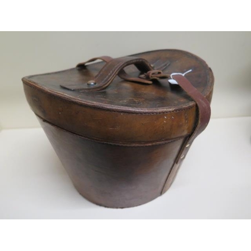 288 - A Victorian leather top hat box with a tall brushed silk top hat - approx size 7 and a collapsible o... 