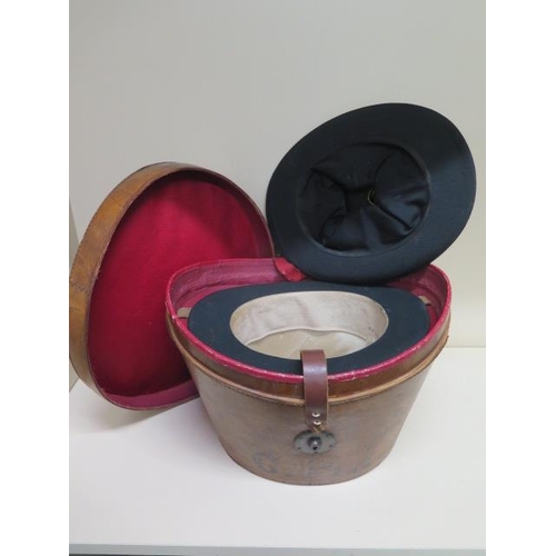 288 - A Victorian leather top hat box with a tall brushed silk top hat - approx size 7 and a collapsible o... 