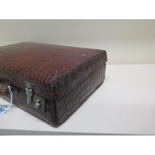 289 - A vintage crocodile correspondence/attache case with fitted interiors - 37cm x 24cm x 11cm - with ol... 