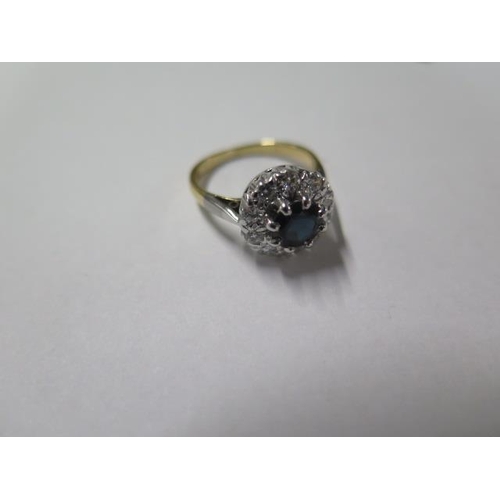 3 - A yellow gold and white metal sapphire and diamond cluster ring, size J, the central sapphire approx... 
