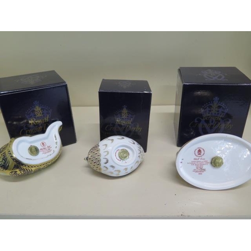 318 - Three boxed Royal Crown Derby paperweights, Black Swan Limited Edition, Harbour Seal Limited Edition... 