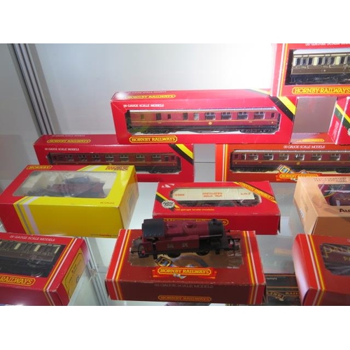 335 - A Hornby 00  gauge LMS 0-6-0 loco boxed, an unboxed loco, 13 boxed rolling stock, a boxed Mainline l... 