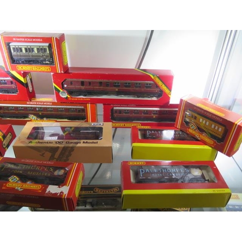 335 - A Hornby 00  gauge LMS 0-6-0 loco boxed, an unboxed loco, 13 boxed rolling stock, a boxed Mainline l... 