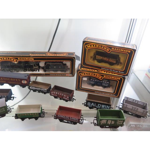 335 - A Hornby 00  gauge LMS 0-6-0 loco boxed, an unboxed loco, 13 boxed rolling stock, a boxed Mainline l... 