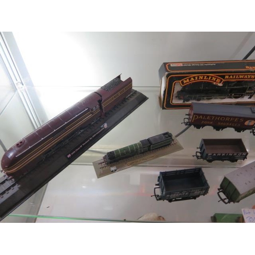 335 - A Hornby 00  gauge LMS 0-6-0 loco boxed, an unboxed loco, 13 boxed rolling stock, a boxed Mainline l... 