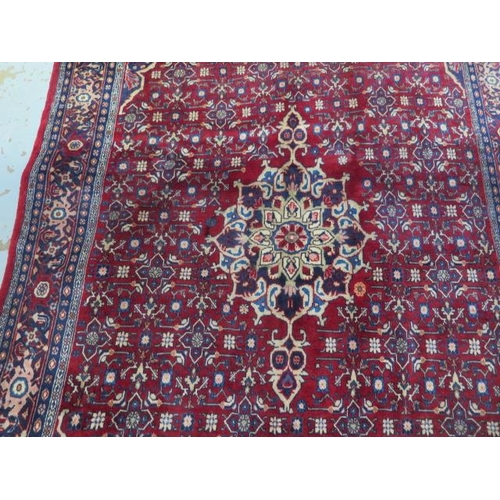 430 - A hand knotted woollen Hamadan rug - 2.10m x 1.37m