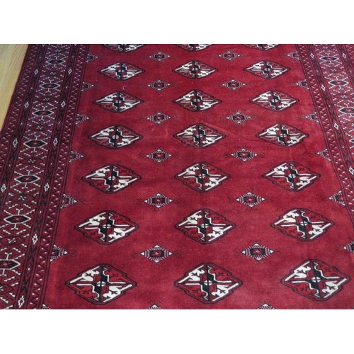 432 - A hand knotted woollen Turkman rug - 2.45m x 1.75m