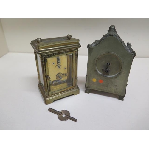 441 - A brass carriage clock and a small mantle clock - Height 14cm - neither working